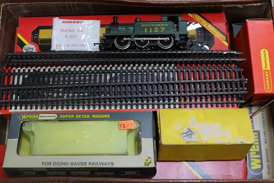A collection of toy railway engines in a case, etc and pine display case